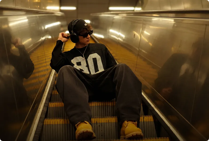 Person tying orange New Balance sneakers